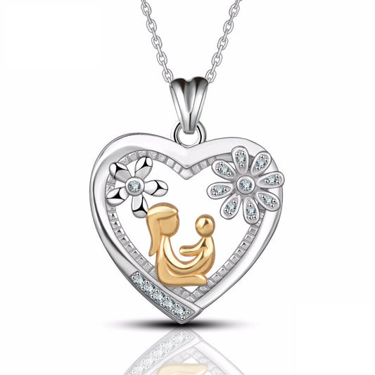 Collar con colgante de corazón de cristal dorado de mamá sosteniendo a su bebé en plata de ley 925