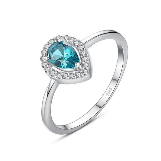 Anillo de compromiso con topacio azul ovalado