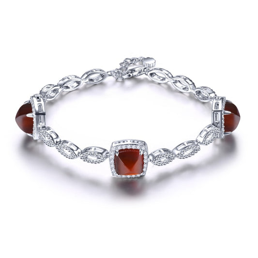 Pulsera de plata con cabujón de granate spessitite Naturao con diseño de Pan de Azúcar