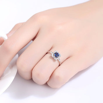 Anillo clásico de flor solitaria de zafiro azul creado